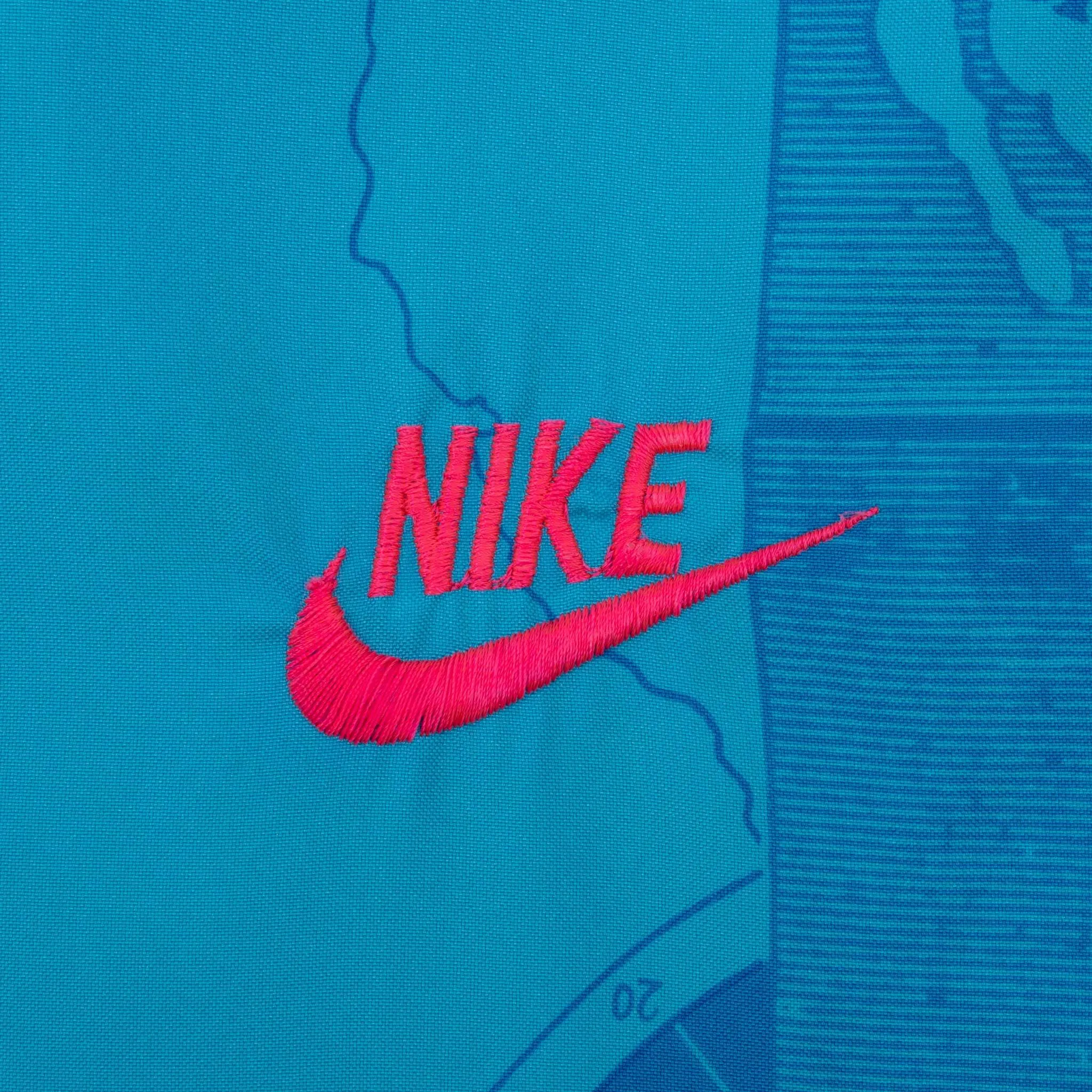 VINTAGE NIKE INTERNATIONAL ALL OVER PRINT BLUE WINDBREAKER JACKET 1990S MEDIUM
